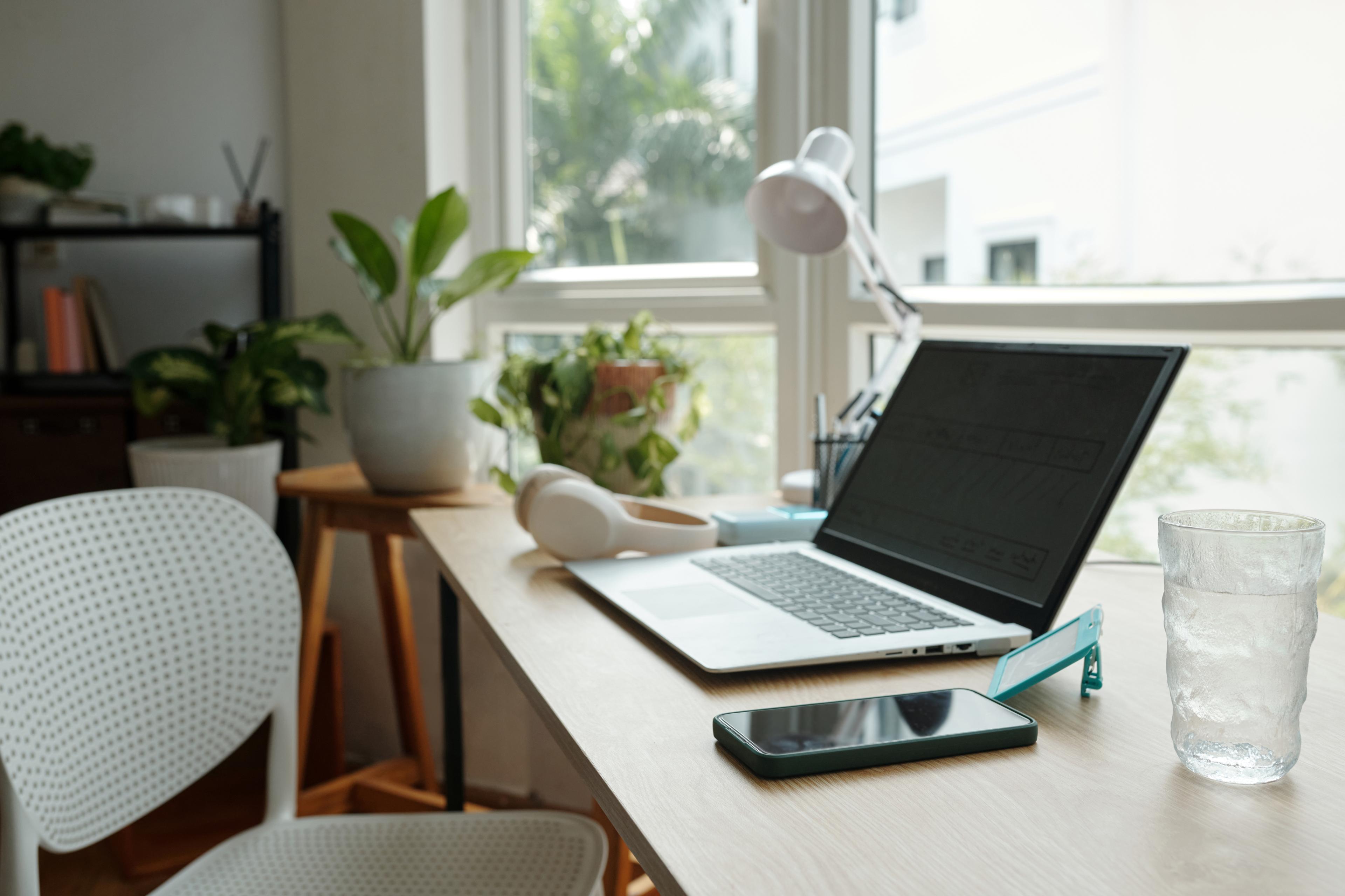 Person working from a home office on a laptop